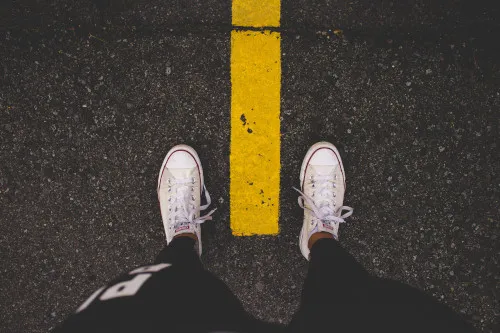 A person looking down at their feet.